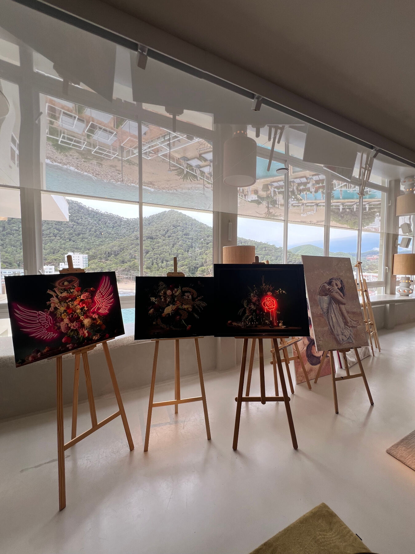 Curated line-up of works installed by the panoramic windows.