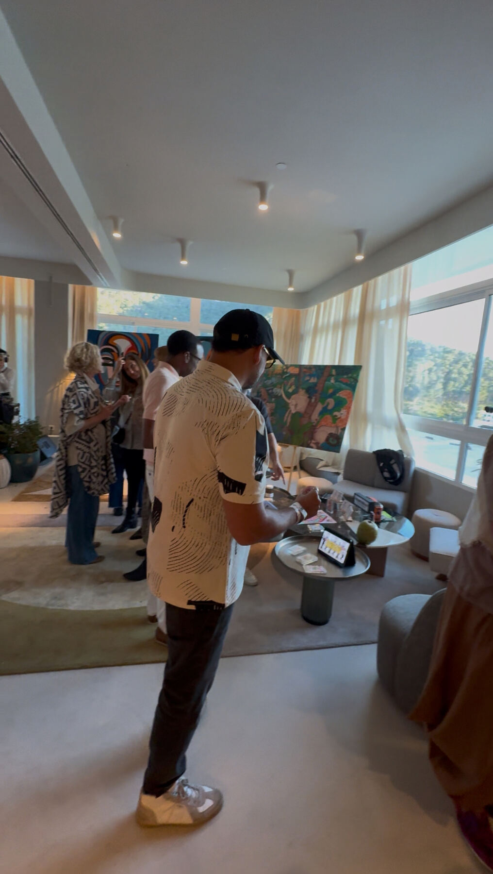 Tarot reading corner — guests gathered around the works.