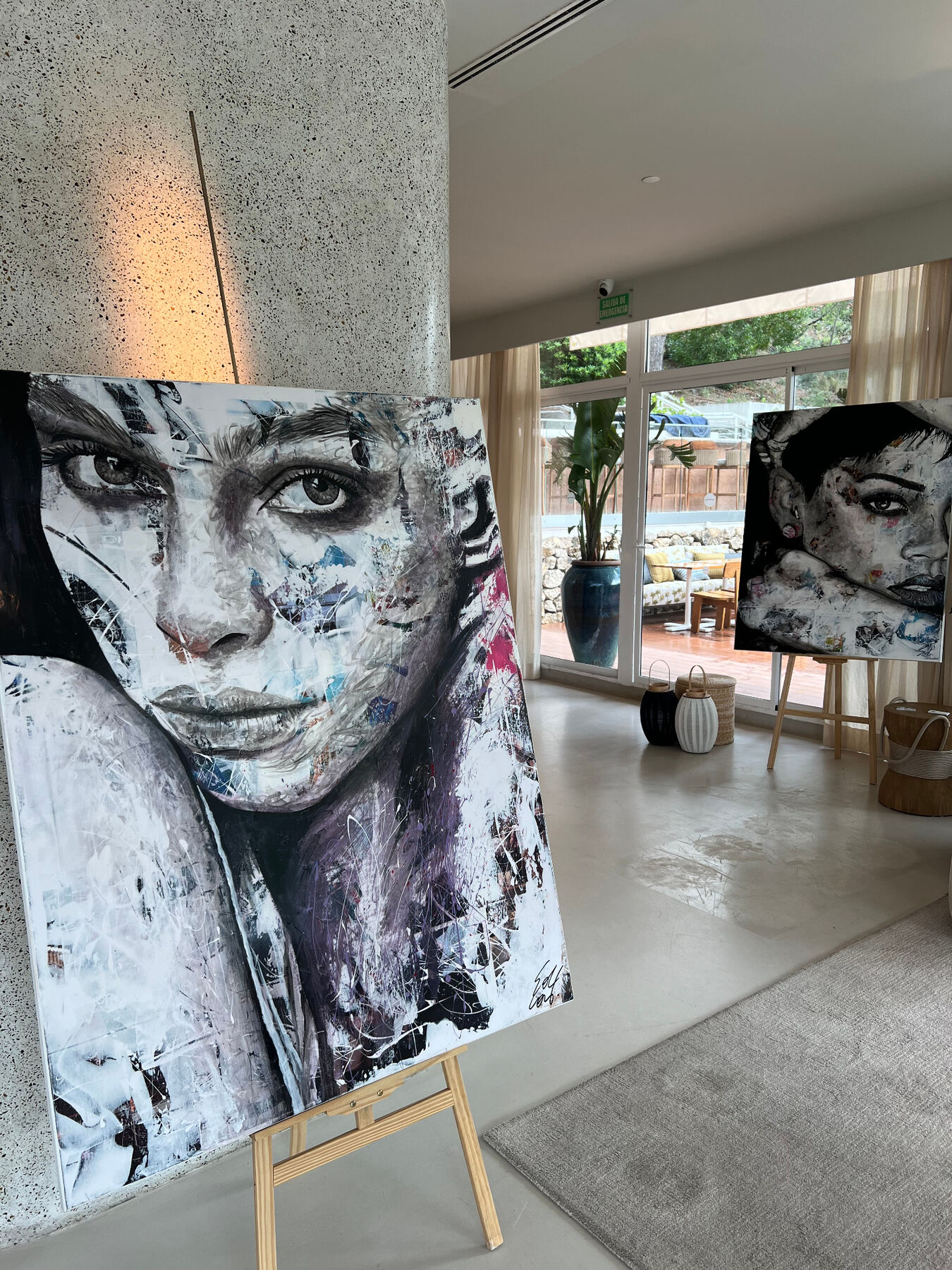 Mixed-media portraits on display.