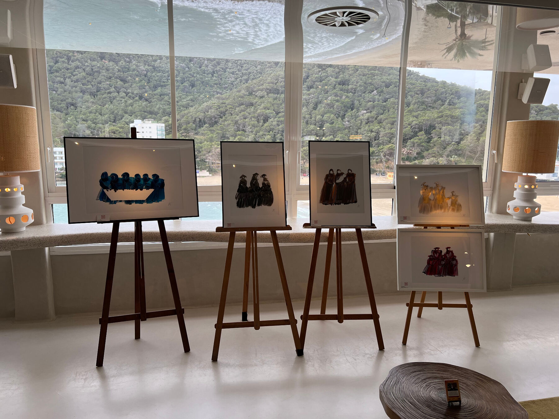 Watercolour series framed against the bay view.